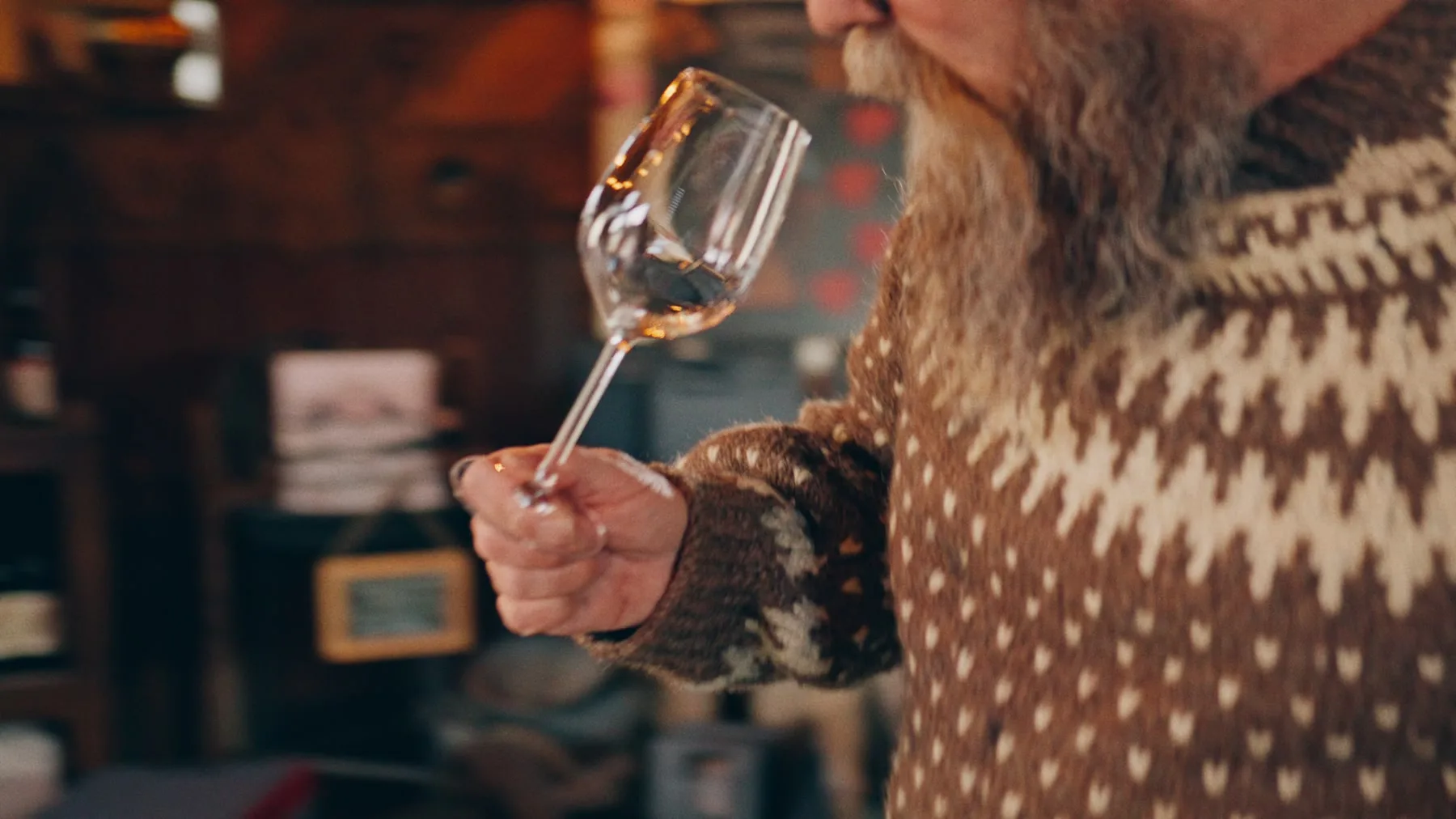 Close detail of a wine glass from the Jason Parkes Customs commercial.