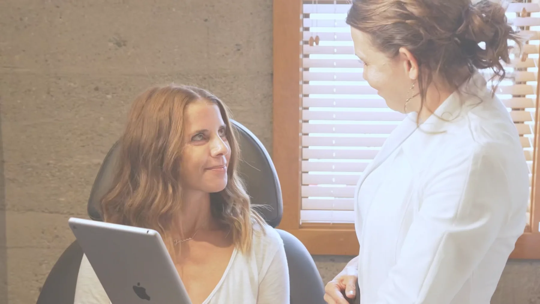 Client greeting frame from the Kelowna Medical Aesthetics video package.