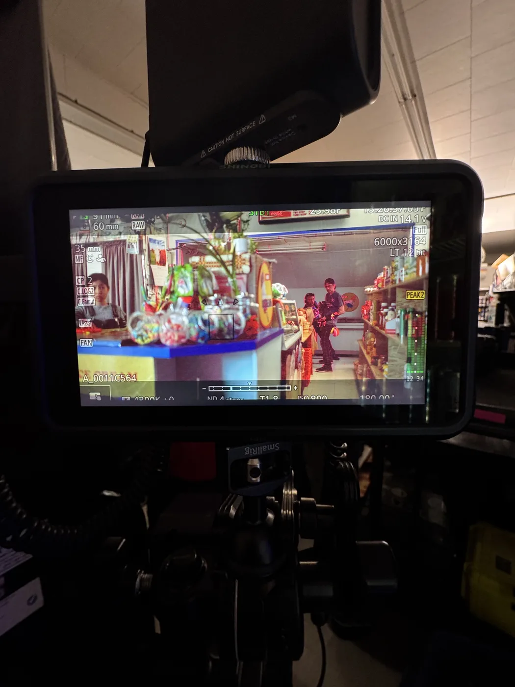 Camera monitor showing The Knitting Diaries convenience-store frame.