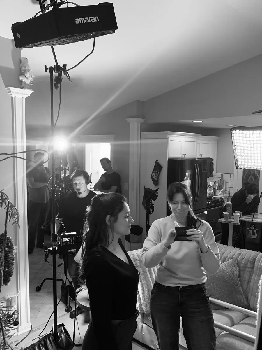 Wide behind-the-scenes view of crew and lighting for The Letter