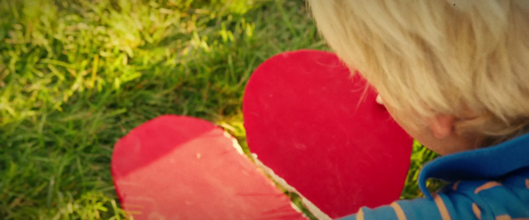 Young Dave looks down at the broken red heart in a finished frame from Three Hearts.